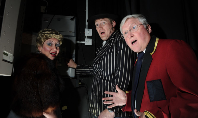 Backstage at the theatre are, from left, Joanna Fitzgerald, Kevin Smith and Roger Brunton.