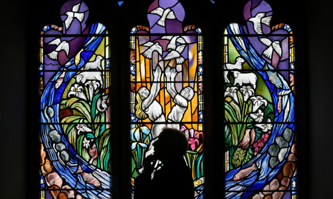 The stain glassed memorial window commemorating the tragedy.