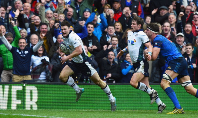 Duncan Taylor goes in for his solo try for Scotland against France.