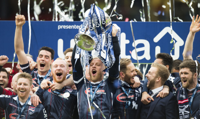 Ross County captain Andrew Davies with the trophy.