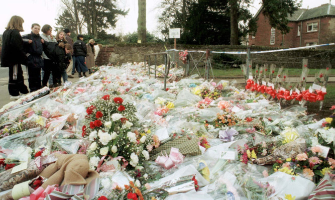 Flowers outside Dunblane Primary School after the shooting in which 16 pupils and their teacher were killed.