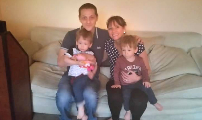 Mervyn Scott and Sarah Aitken with their twins Rhys and Shaun Scott who drowned in a fish pond in Dalgety Bay at the weekend.