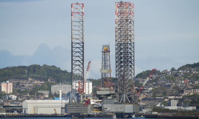 An oil rig undergoing maintenance at Dundee Port.