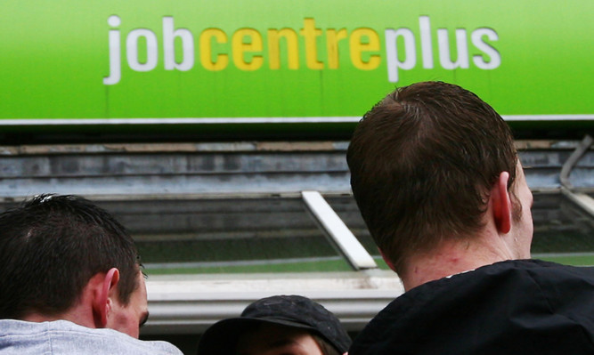 A group of men wait outside Chatham Job Centre Plus in Kent. Picture date: Thursday 19th March 2009. See PA story credit should read: Gareth Fuller/PA Wire ... Unemployment figures ... 19-03-2009 ... Chatham ... UK ... Photo credit should read: Gareth Fuller/PA Archive. Unique Reference No. 7023143 ...