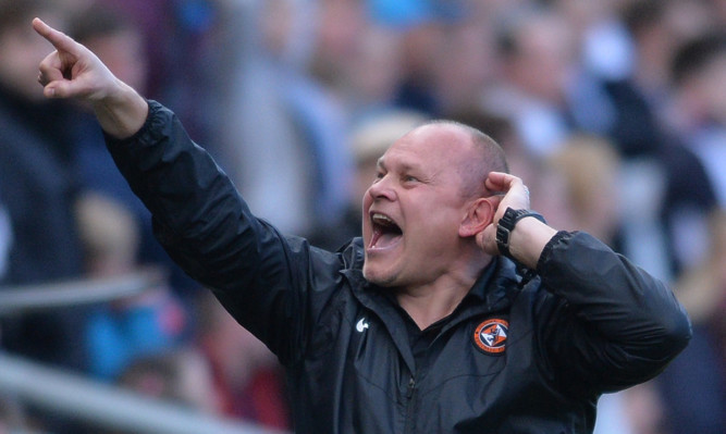 Mixu Paatelainen gestures to the Dundee fans behind his dugout after United's late equaliser.