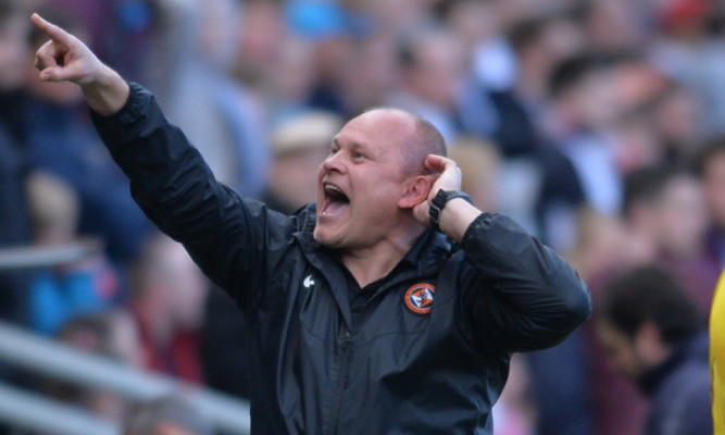 Mixu gestures towards the Dundee fans.