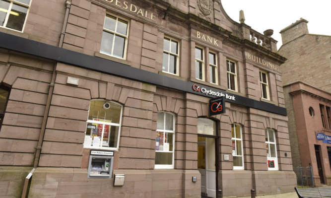 The charges allege Jonathan Gourley was forced to withdraw cash from the Clydesdale Bank in Forfar.