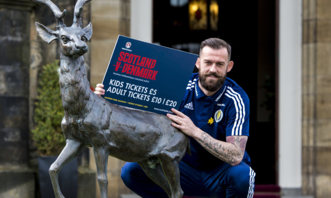 Steven Fletcher takes a break from training to plug the home friendly against Denmark.