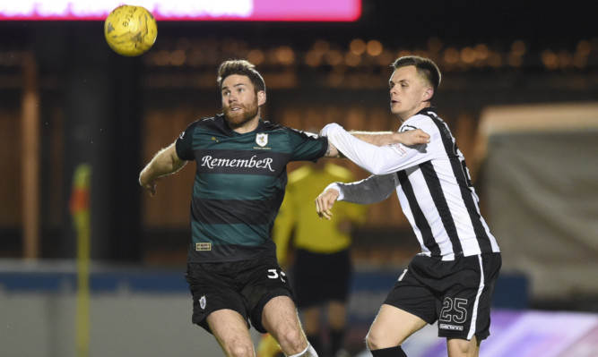 Craig Barr shrugs off a challenge by St Mirrens Lawrence Shankland.