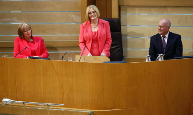 Presiding Officer Tricia Marwick (centre) says her farewell to Parliament. She is watched by deputies Elaine Smith and John Scott.