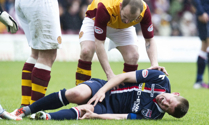 Richie Brittain lies in agony after suffering his injury at the weekend.