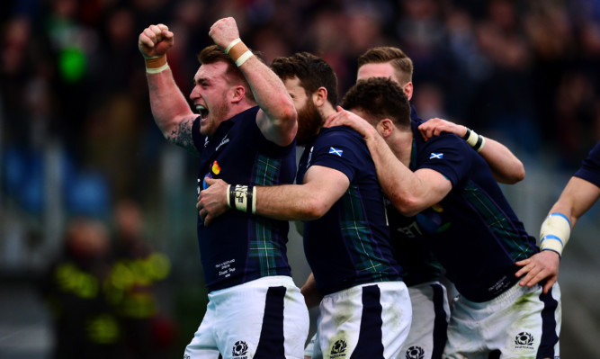 Stuart Hogg celebrate during Scoitland's win in Italy.