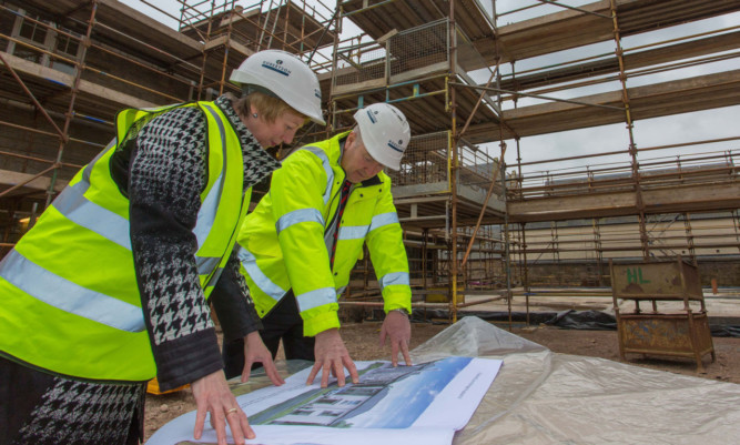 Robertson Homes managing director John Murphy shows Councillor Lesley Laird around the development.