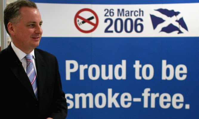 Scotland's then First Minister Jack McConnell attends a smoke free event at Edinburgh Airport on March 26, 2006.