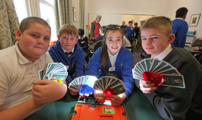 Pupils from Claypotts PS who took part in a mini bridge tournament at Dundee Bridge Club, left to right, James Getty,Cameron Wood,Chevonne Queen and Daryn Downie.