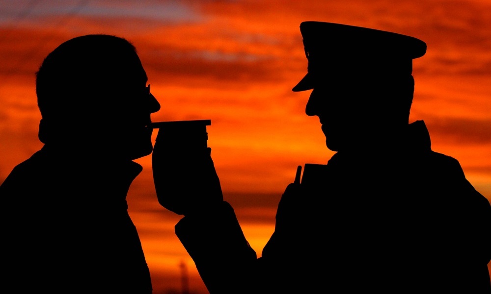 Embargoed to 0001 Friday November 7 File photo dated 30/11/06 of a police officer carrying out a breathalyser test, as a survey showed that fifty years on from the first anti-drink-drive campaign, nearly all motorists would be ashamed to be caught over the limit.