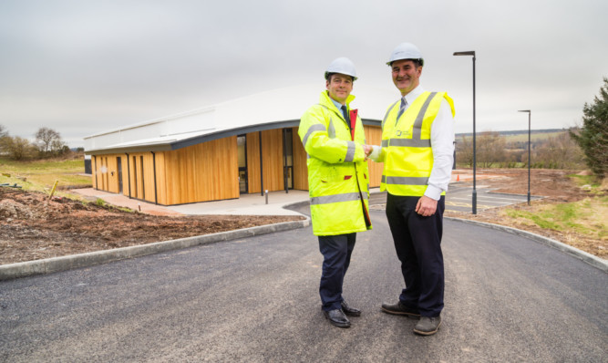 School bursar Anthony Glasgow and project manager Stevie White outside the new studio.