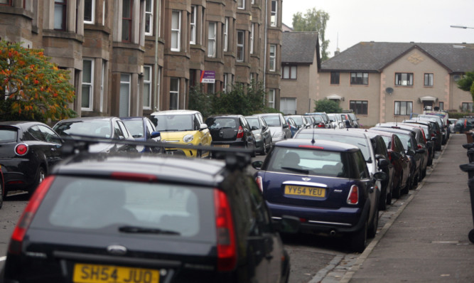 Cars parked in Bellfield Avenue.