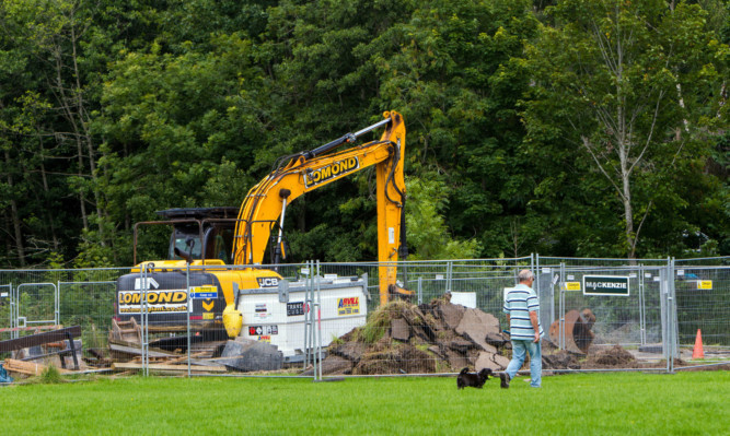 Part of the defences has been unearthed after a row over the land.