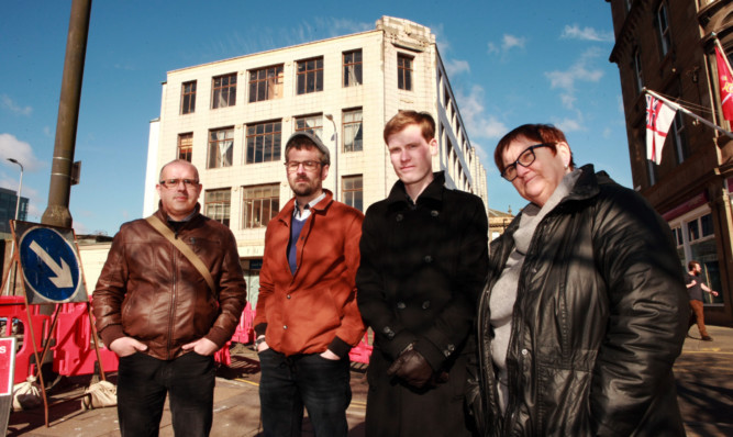 From left:, Ian McKay, Phil Doig, Neil Morrison, Pam Turner who are opposed to the demolition of the former Robertson's furniture store.