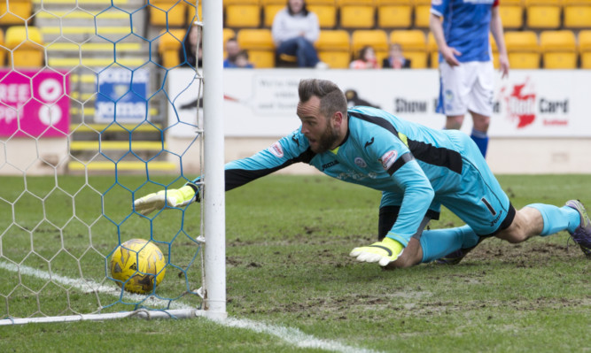 Alan Mannus fails to keep out Ryan Dow's effort.