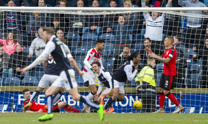 Raith Rovers Harry Panayiotou, centre right, runs away to celebrate after firing home the late equaliser that left Rangers and their fans stunned.