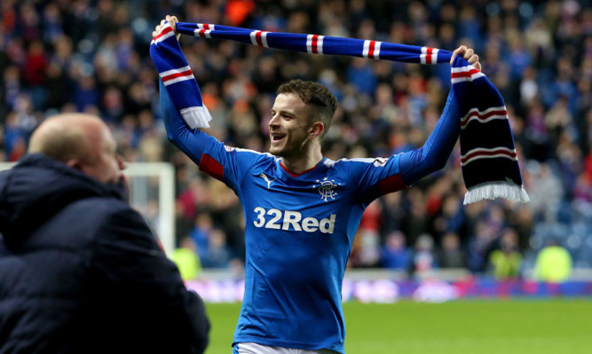 Rangers' Andy Halliday celebrates after his side clinched promotion.