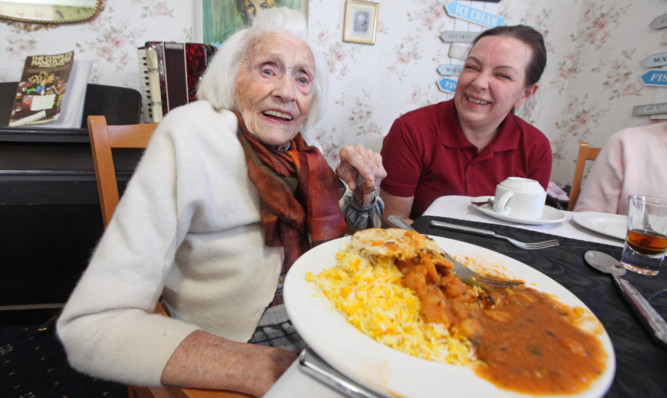 103-year-old Margaret Phillips enjoys her winning party at Balcarres Care Home in Dundee.