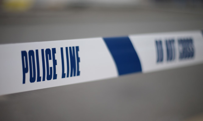 Police tape mark the cordoned off area on the junction of Church Road and Conley Road in Harlesden, north west London, after a man was shot dead the previous evening.