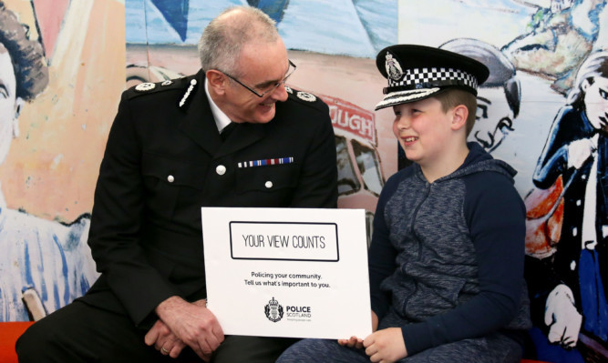 Police Scotland Chief Constable Phil Gormley chats with Levi Murray at the launch of a new online public survey.
