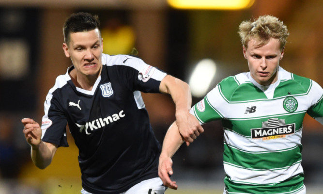 Thomas Konrad battles for the ball against Celtic's Gary Mackay-Steven.