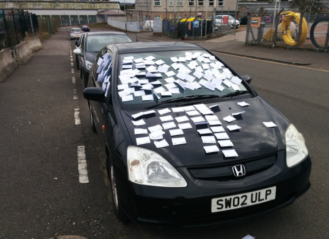 Car left covered with blank notelets