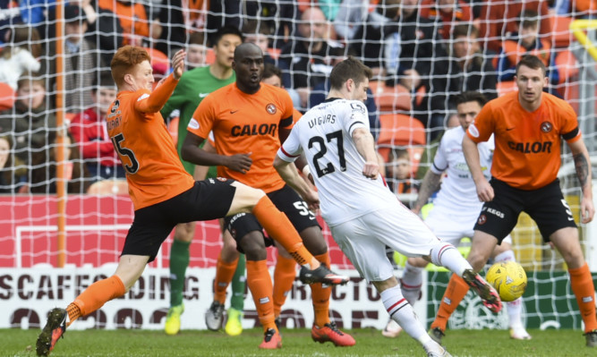 Iain Vigurs scores his side's second goal.