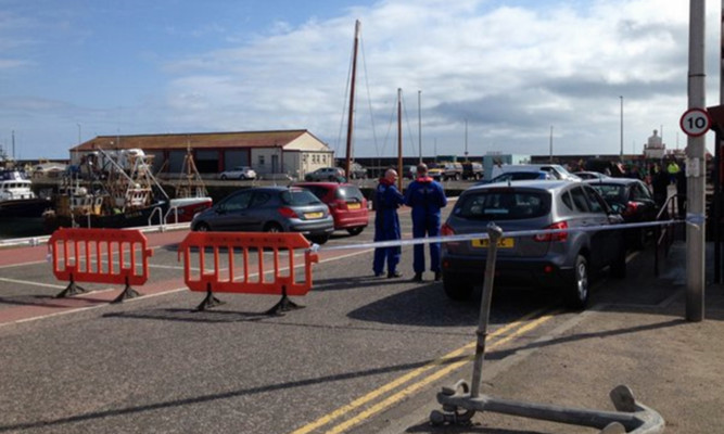 Police at Arbroath Harbour after a woman''s body was discovered.