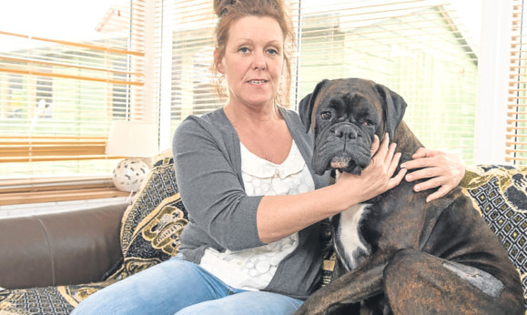 Lara Mitchell and her pet Kayla, showing the signs of injury.