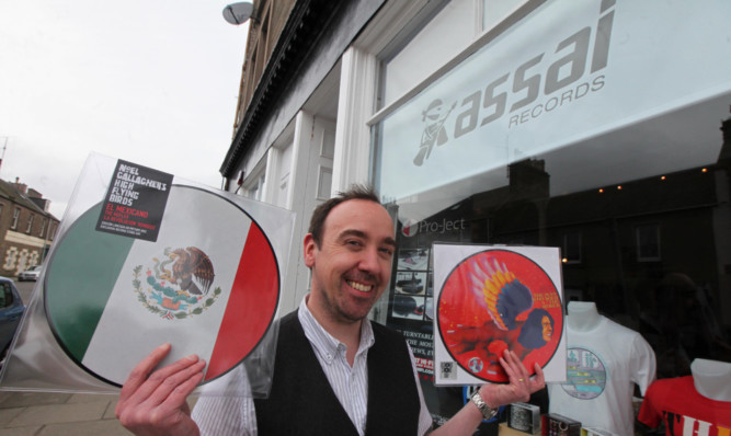 Keith Ingram with some limited edition records that will be on sale at Assai.
