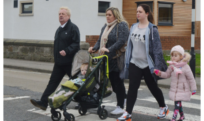 From left: Councillor John OBrien, Jackie Brown and Shannon Baxter with children Ryan and Indie on the crossing outside Woodlands Nursery Centre.