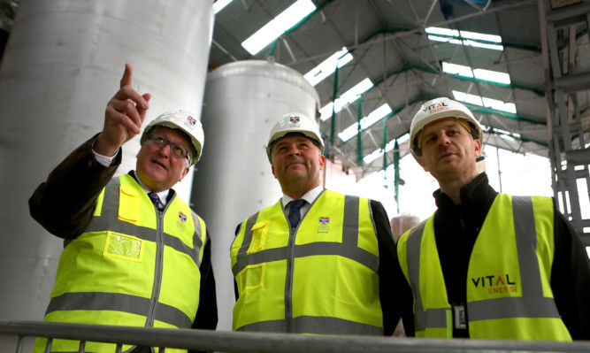 Fergus Ewing (left) being shown around by Derek Watson and Vital construction manager David Raley.