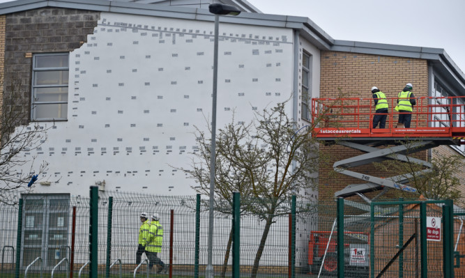 Workmen carry out repairs at Oxgangs Primary School.