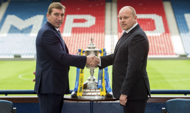 Alan Stubbs (left) shakes hands with Mixu Paatelainen ahead of the big game.