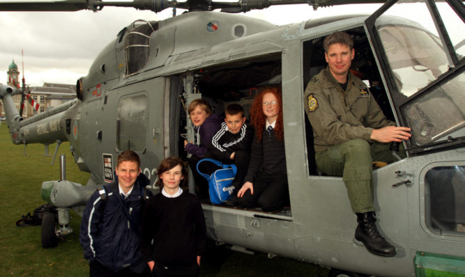 Lt Neyland with some of the pupils.