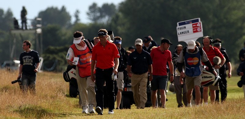 Steve MacDougall, Courier, Carnoustie Links, Carnoustie. Senior Open Championship 2010. Scenes from the final day. Pictured, Bernhard Langer walks down the 18th, with Corey Pavin behind.