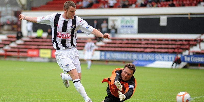 Andy Kirk scores past Darren Hill