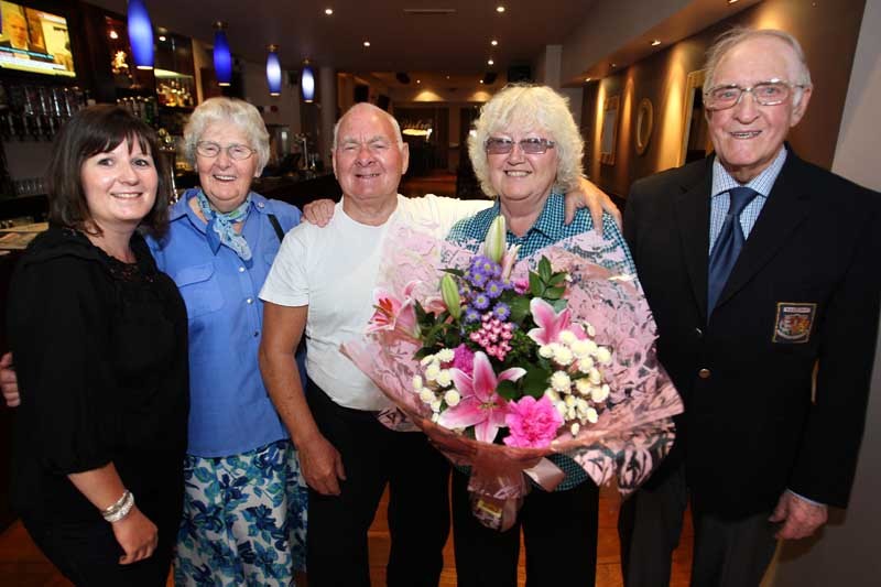 Kris Miller, Courier, 26/07/10, News. Picture today at Ogstons Cafe, Arbroath. A couple celebrated their 50th wedding anniversary in the town they got married in today. Mr and Mrs Alister (correct) and Maureen Petrie returned to the town with daughter Tina to celebrate with friends and family. Pic shows L/R, Tina (daughter), Mrs Elizabeth Fenton (Alister's sister), Alister and Maureen and Mr William Fenton.