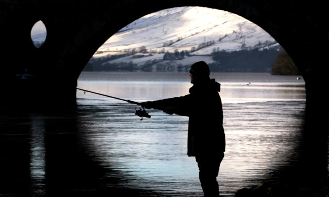 A Fisherman casts his line into the river Tay at Kenmore as the salmon fishing season was declared open.