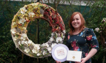 Paula with her medal and her display.