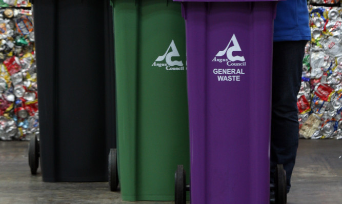 Kris Miller, Courier, 29/08/12. Picture today at Peassiehill Recycling Centre, Arbroath where Angus Counicl launched their new recycling trial with new bins. Pic shows L/R, Donald Morrison (Convenor, Neighbourhood Services) and Donna Smith (Recycling Operative) and Jeanette Gaul (Vice Convenor, Neighbourhood Services).