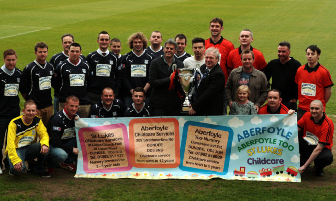 Darren Jackson representing Dundee United and John Keith from the DFC Supporters Society surrounded by players who will be representing their teams on Saturday.