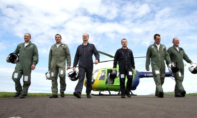 Some of the paramedics and pilots who will be using the new helicopter.
