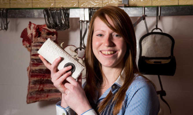 Jocelyn with one of her bags lined with cows stomach lining.